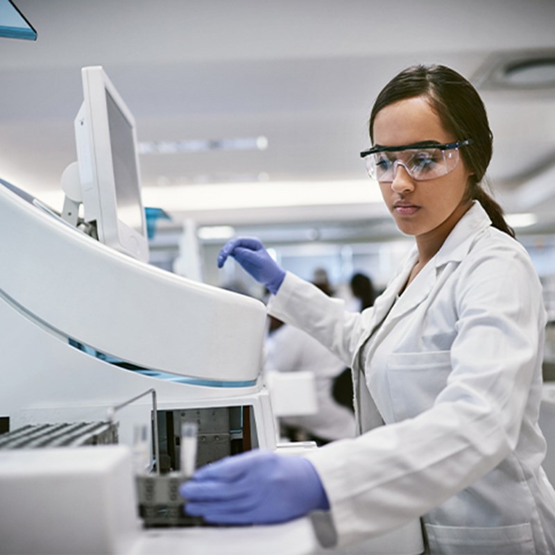 Woman in lab testing samples.